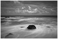 Volcanic rock and wave motion. Kauai island, Hawaii, USA (black and white)