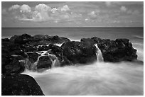 Balsalt and surf motion. Kauai island, Hawaii, USA ( black and white)