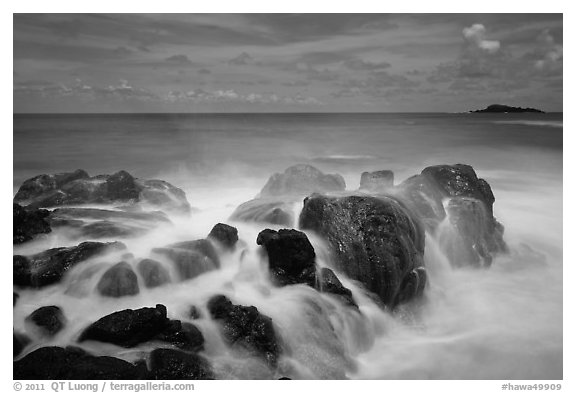 Rock with water motion and Mokuaeae island. Kauai island, Hawaii, USA (black and white)