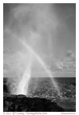 Spouting Horn with rainbow in spray. Kauai island, Hawaii, USA (black and white)