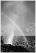 Spouting Horn with rainbow in spray. Kauai island, Hawaii, USA ( black and white)