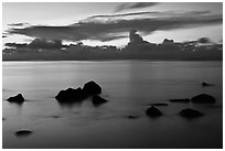 Rocks and cloud band, sunset. Kauai island, Hawaii, USA ( black and white)