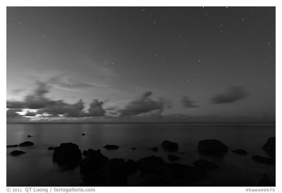 Rocks, ocean, and stars. Kauai island, Hawaii, USA (black and white)