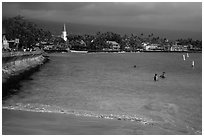 Beach, seawall and town, Kailua-Kona. Hawaii, USA (black and white)