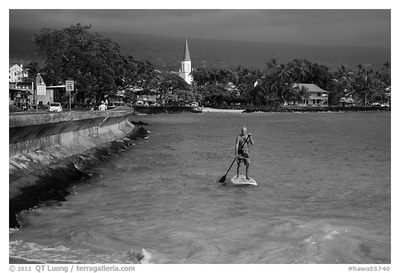 Paddlesurfer and Kailua-Kona. Hawaii, USA (black and white)