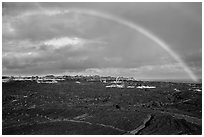 Rainbow over lava fields, Kalapana. Big Island, Hawaii, USA (black and white)