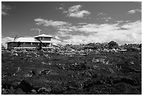 House and recently hardened lava. Big Island, Hawaii, USA ( black and white)