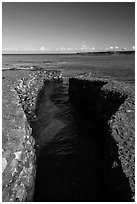 Walled stream and Kiholo Bay. Big Island, Hawaii, USA (black and white)