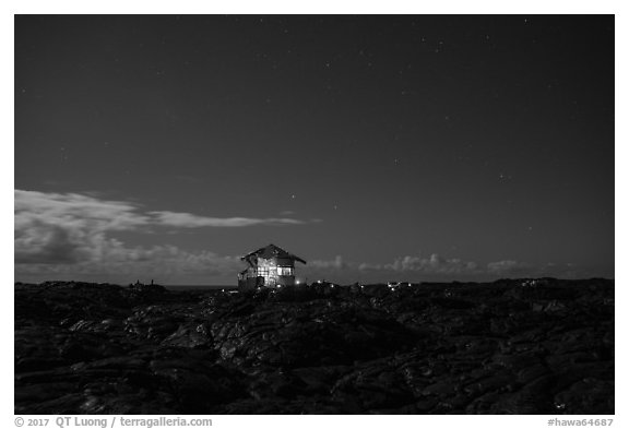 Illuminated house on the lava field, Kalapana. Big Island, Hawaii, USA (black and white)