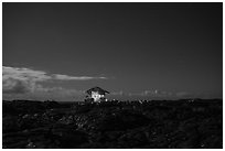 Illuminated house on the lava field, Kalapana. Big Island, Hawaii, USA ( black and white)