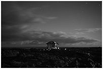 Lone house on the lava field at night, Kalapana. Big Island, Hawaii, USA ( black and white)