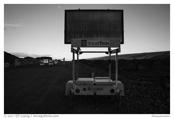 Sign and gate on emergency road, Kalapana. Big Island, Hawaii, USA (black and white)