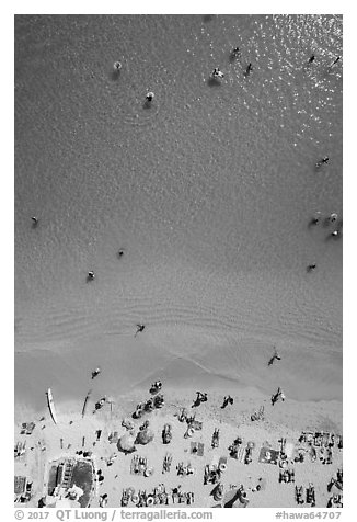 Aerial view of ocean water and beach shore looking down, Kuhio Beach. Waikiki, Honolulu, Oahu island, Hawaii, USA (black and white)