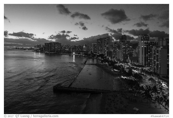 Aerial view of Kuhio Beach, skyline at dusk. Honolulu, Oahu island, Hawaii, USA (black and white)