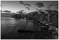 Aerial view of Kuhio Beach, skyline at dusk. Honolulu, Oahu island, Hawaii, USA ( black and white)