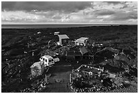 Aerial view of house on lava field, Kalapana. Big Island, Hawaii, USA ( black and white)