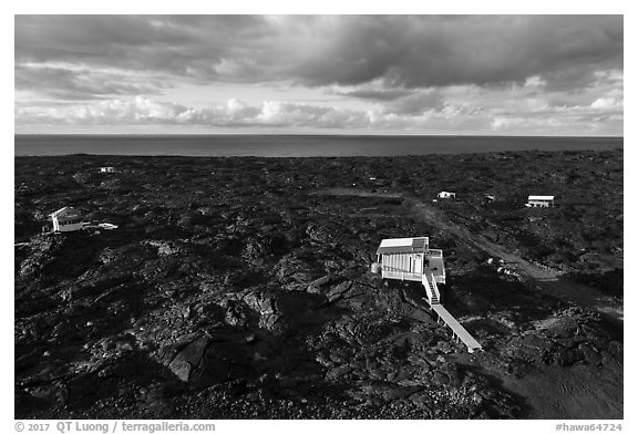 Aerial view of houses on new lava field, Kalapana. Big Island, Hawaii, USA (black and white)