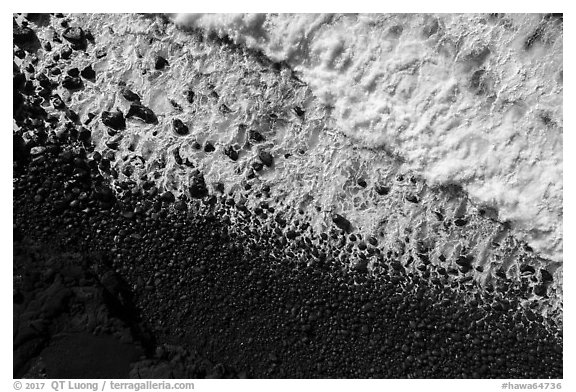 Aerial view of surf and lava rocks looking down, Kaimu Beach. Big Island, Hawaii, USA (black and white)