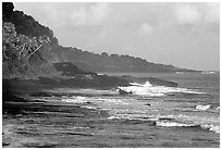 Fisherman on rocky coast near Vailoa. Tutuila, American Samoa (black and white)