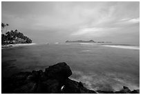 Sunset over Aunuu island with crab on basalt rock. Aunuu Island, American Samoa ( black and white)