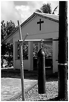 Gong and church, Aunuu village. Aunuu Island, American Samoa (black and white)