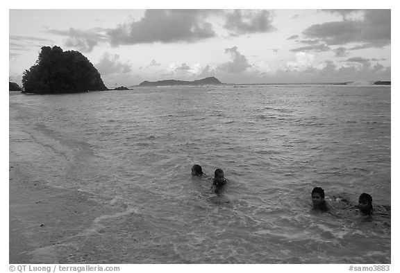 Children in the water. Tutuila, American Samoa (black and white)