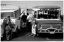 People and colorful buses. Pago Pago, Tutuila, American Samoa (black and white)