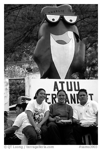 Women in front of statue of Charlie the Tuna. Pago Pago, Tutuila, American Samoa