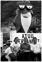 Women in front of statue of Charlie the Tuna. Pago Pago, Tutuila, American Samoa (black and white)