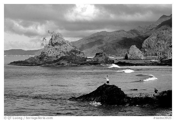 Fishermen on the rocky shore near Maa Kamela. Tutuila, American Samoa