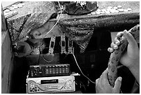 Hands of Aiga bus driver and sound system. Pago Pago, Tutuila, American Samoa (black and white)