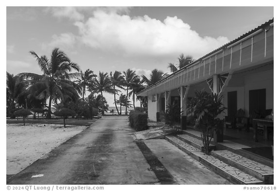 Store and beachfront, Olosega. American Samoa (black and white)