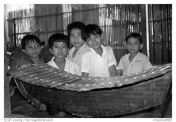 Boys with a traditional musical instrument. Phnom Penh, Cambodia