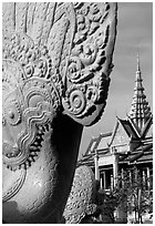 Statue and pagoda, Royal palace. Phnom Penh, Cambodia (black and white)