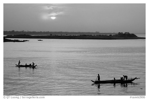 Boats at sunrise, Tonle Sap river,  Phnom Phen. Cambodia