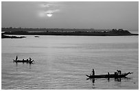 Boats at sunrise, Tonle Sap river,  Phnom Phen. Cambodia ( black and white)