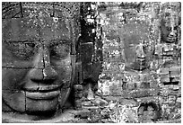 Serene and massive stone faces, the Bayon. Angkor, Cambodia ( black and white)