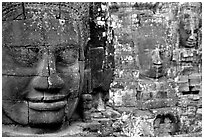 Serene and massive stone faces, the Bayon. Angkor, Cambodia (black and white)