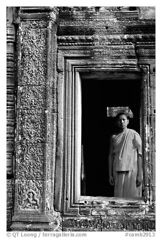 Buddhist monk in doorway, the Bayon. Angkor, Cambodia (black and white)