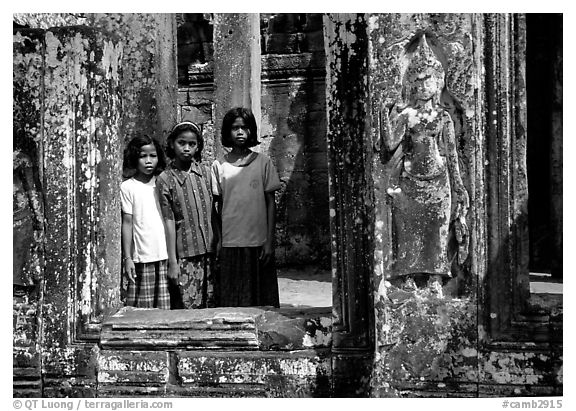 Girls in temple complex, the Bayon. Angkor, Cambodia