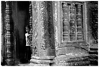 Girl hides in Ta Prom. Angkor, Cambodia (black and white)