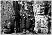 Large stone faces occupying towers, the Bayon. Angkor, Cambodia (black and white)