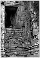 Boy hides in the Bayon. Angkor, Cambodia (black and white)