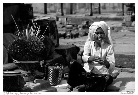 Incence vendor wearing traditional headcloth. Angkor, Cambodia (black and white)