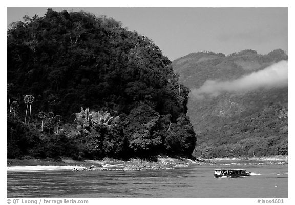 Slow passenger boat near Pak Ou. Mekong river, Laos (black and white)