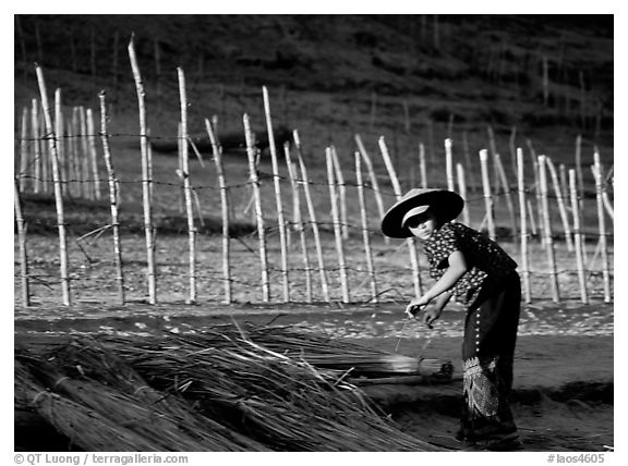 Villager and fence. Mekong river, Laos