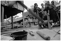 Preparation of rice in a small hamlet. Mekong river, Laos (black and white)