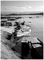 Slow passenger boats in Huay Xai. Mekong river, Laos (black and white)