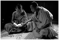 Buddhist novice monks reading. Luang Prabang, Laos (black and white)