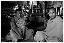 Buddhist novice monks inside temple. Luang Prabang, Laos (black and white)